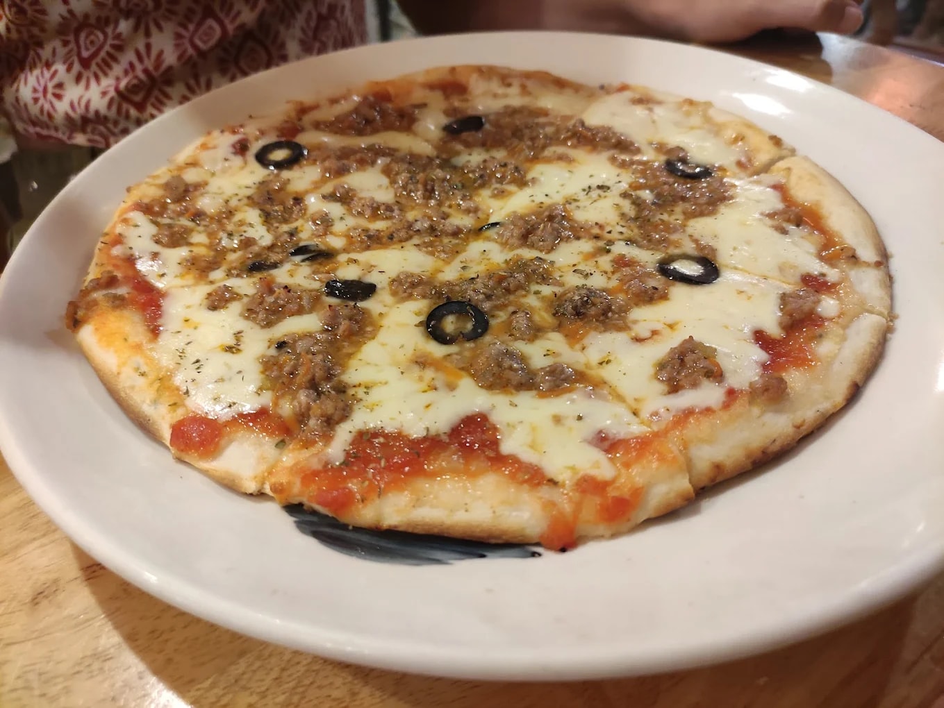 The pizza here features a golden crust, rich cheese, and well-seasoned toppings made fresh to order
